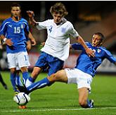 England's John Swift tackled by Italy's Filippo Penna